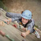Girl on a climbing wall