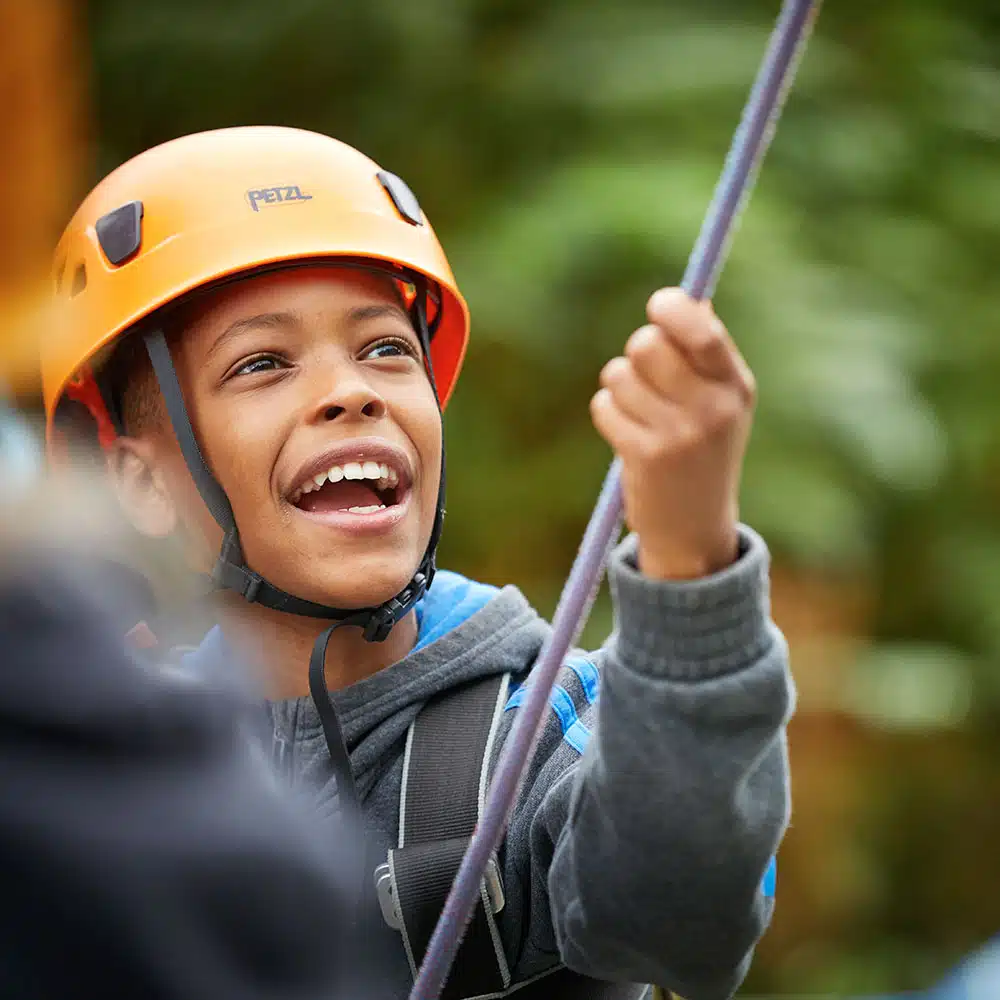 Young boy on a climbing activity session