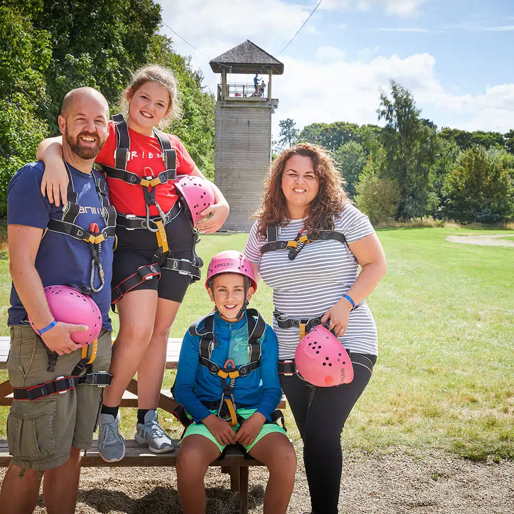 Family in front of a activity tower