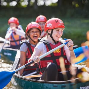 Girls paddling in a Canoe