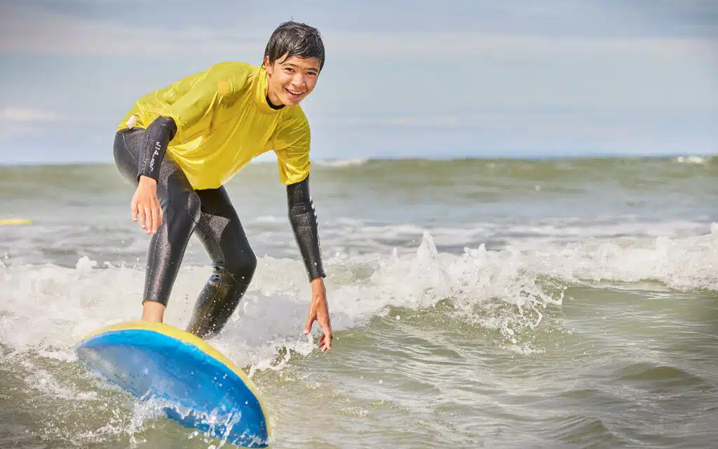 Boy surfing at PGL