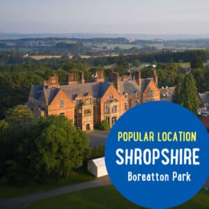 Aerial view of Boreatton Park in Shropshire with surrounding trees and landscape. Blue circle in the foreground reads "Popular Location Shropshire Boreatton Park.