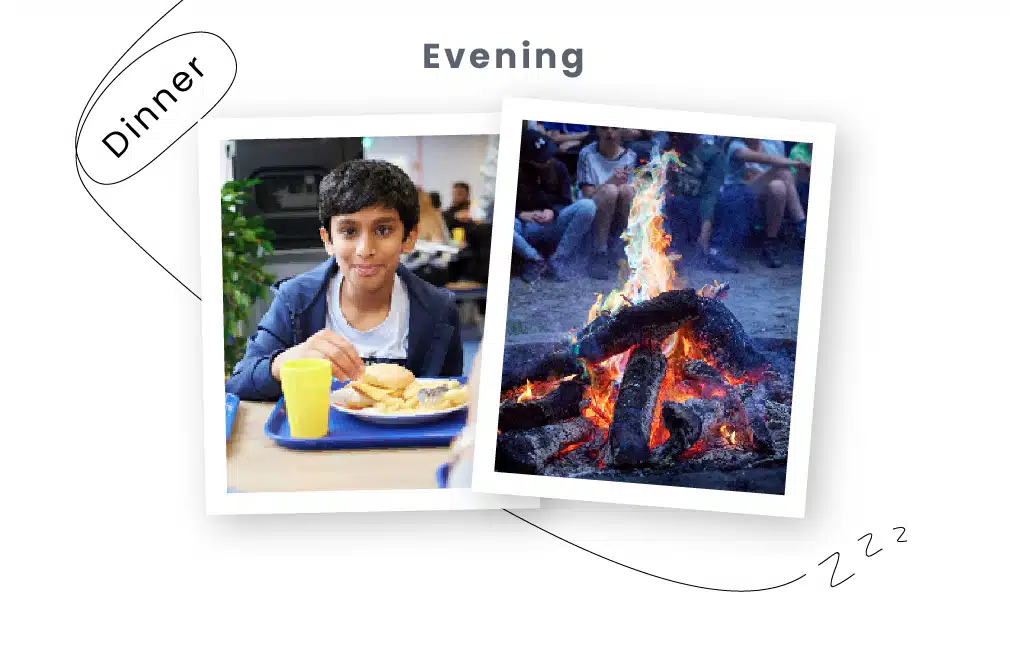 A boy smiling at the dinner table with a plate of food and a campfire burning brightly during a PGL Adventure Holidays evening.