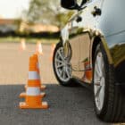 Car next to orange cones