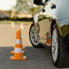 Car next to orange cones
