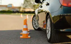 Car next to orange cones