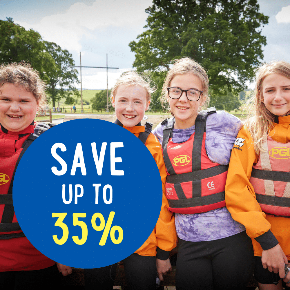 Four children wearing orange life jackets and smiling stand outdoors. A blue circle on the image reads "SAVE UP TO 35%." Trees and a field are visible in the background.