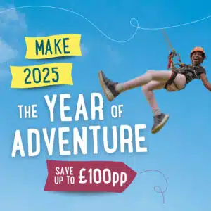 Person zip-lining against a blue sky with text: "Make 2025 the Year of Adventure. Save up to £100pp.