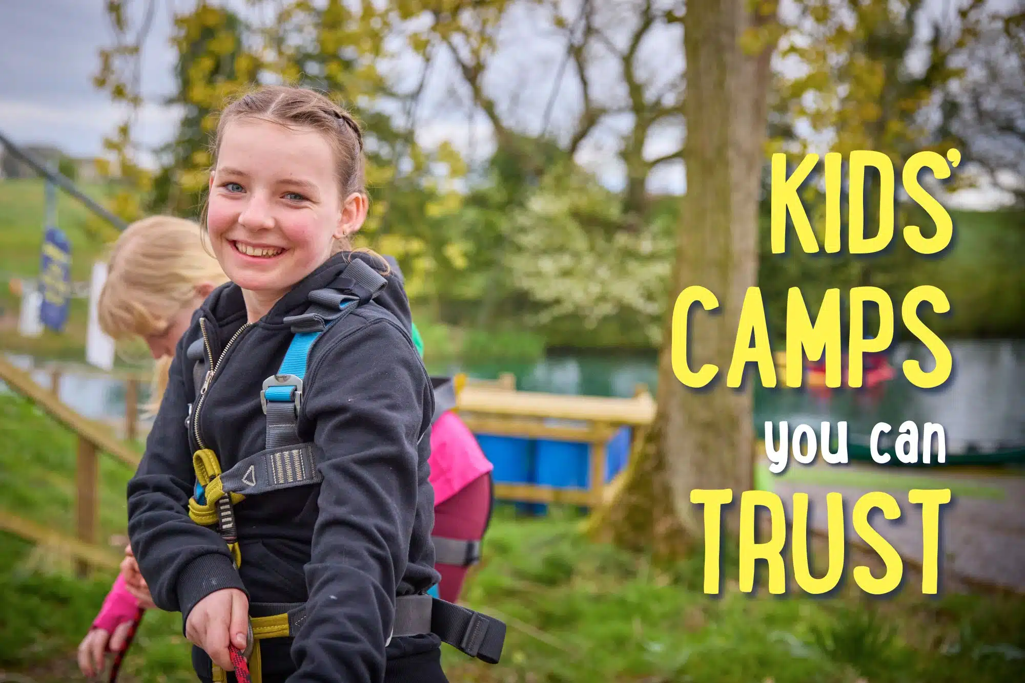 Smiling girl in outdoor gear stands in front of a harness course; text reads “Kids’ camps you can trust.”.