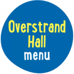 A blue circle with the words "Overstrand Hall menu" in yellow and white, bold, playful font.