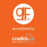 Orange background with a “gf” gluten free logo above the words “accredited by coeliac UK live well gluten free” in white and grey text.