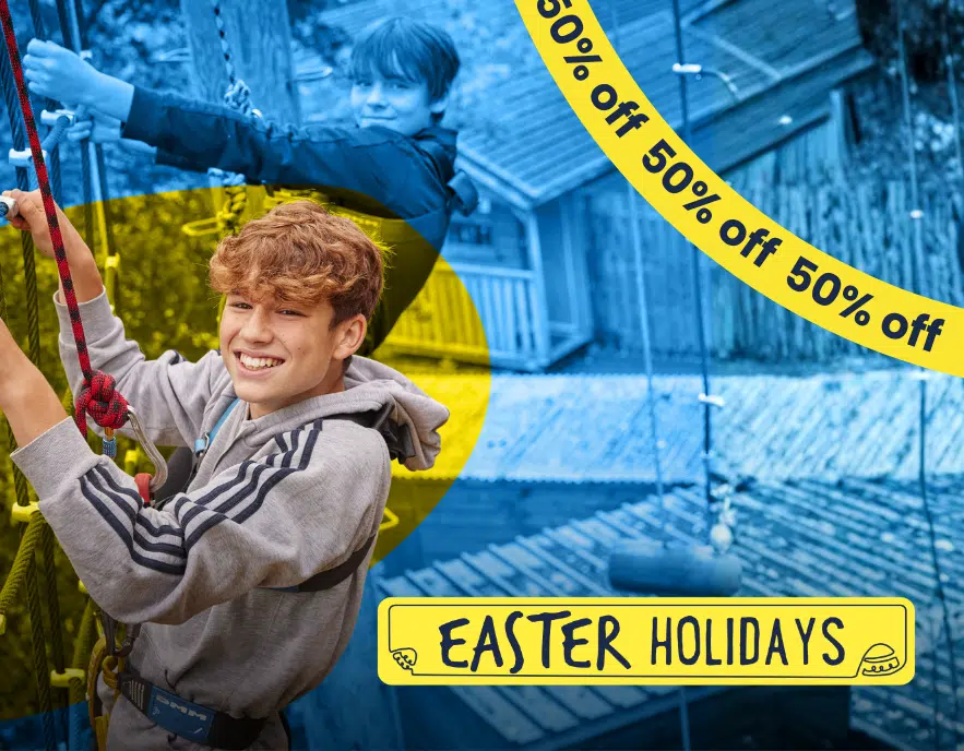Two boys participate in an outdoor climbing activity at PGL Adventure Holidays. A yellow banner at the bottom reads 