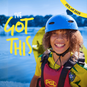 Smiling child wearing a blue helmet and life jacket stands by a lake, with text reading "I've got this" and a yellow label showing "25% off 2026.