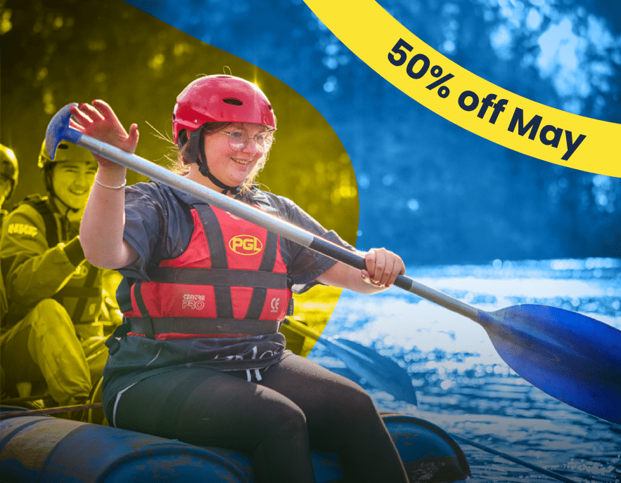 Person in helmet and life jacket paddling a raft on water, with a yellow banner in the corner reading 