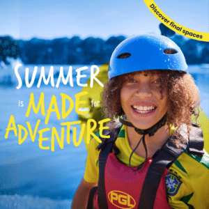 Smiling child in a helmet and life jacket stands near water, with text reading "Summer is made for adventure" and a “Discover final spaces” banner in the corner.