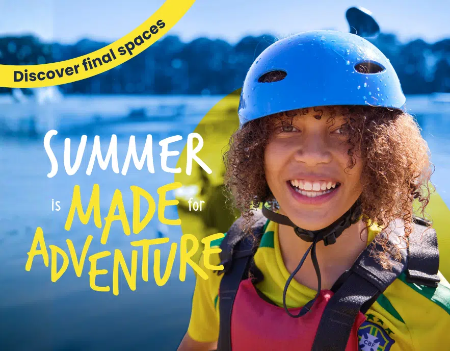 A smiling child in a blue helmet and life vest stands by water, with text reading, 