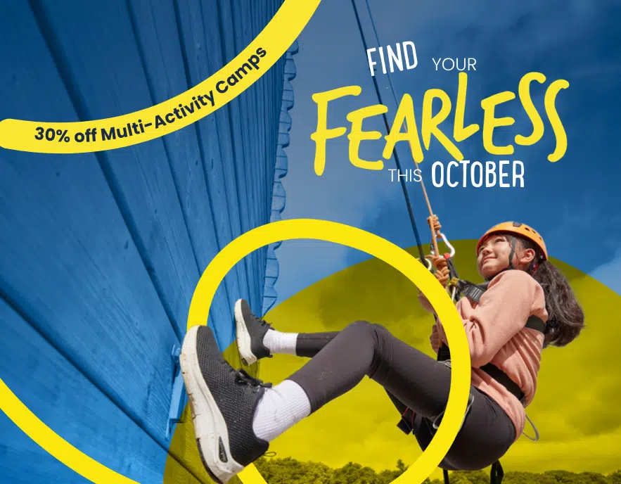 Girl in helmet and harness climbs a rope wall outdoors; text reads “Find your fearless this October” and “30% off Multi-Activity Camps at PGL Adventure Holidays”.