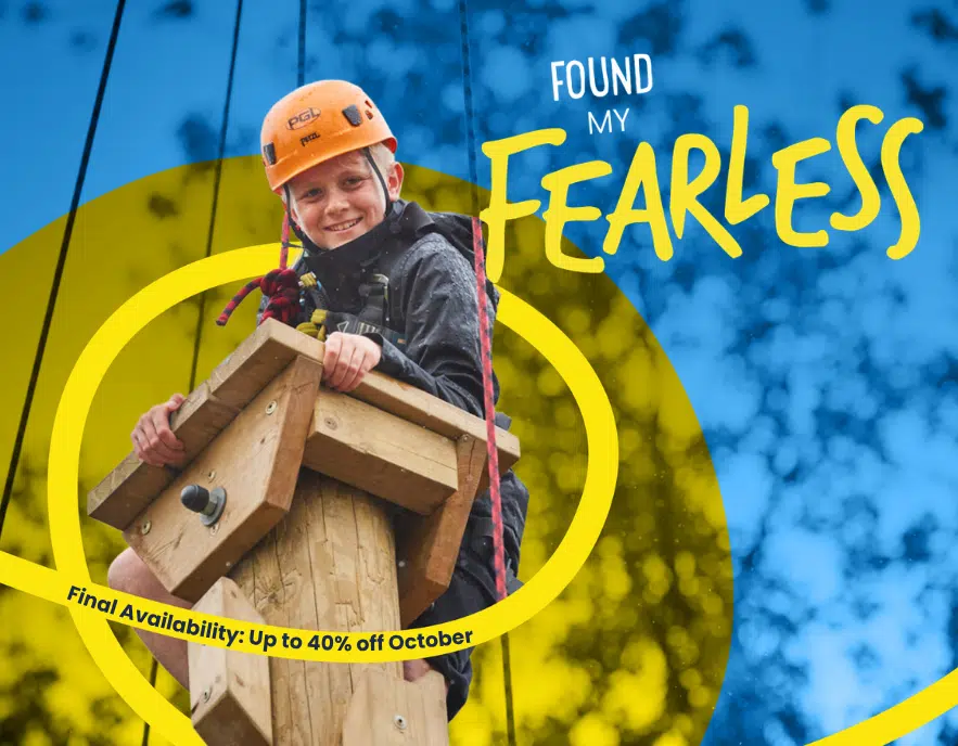 Smiling child in helmet climbs a wooden structure outdoors—PGL Adventure Holidays. Text overlay: “Found My Fearless” and “Final Availability: Up to 40% off October.”.